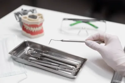 close-up-hand-holding-dental-equipment