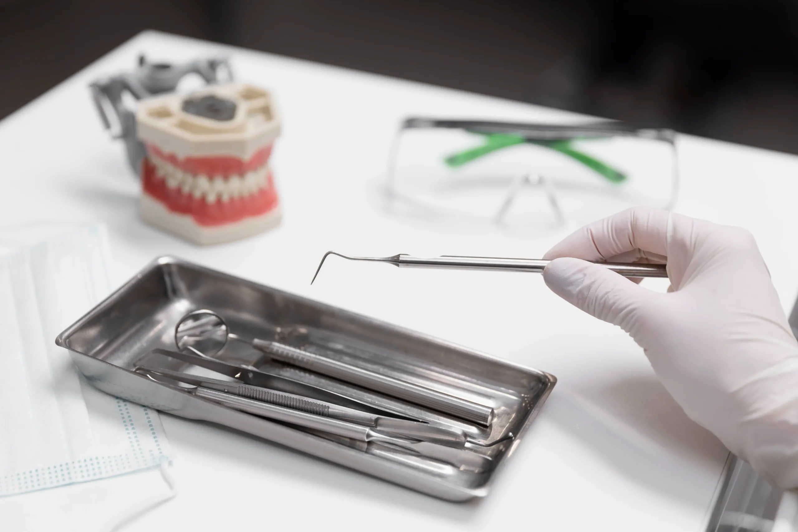 close-up-hand-holding-dental-equipment